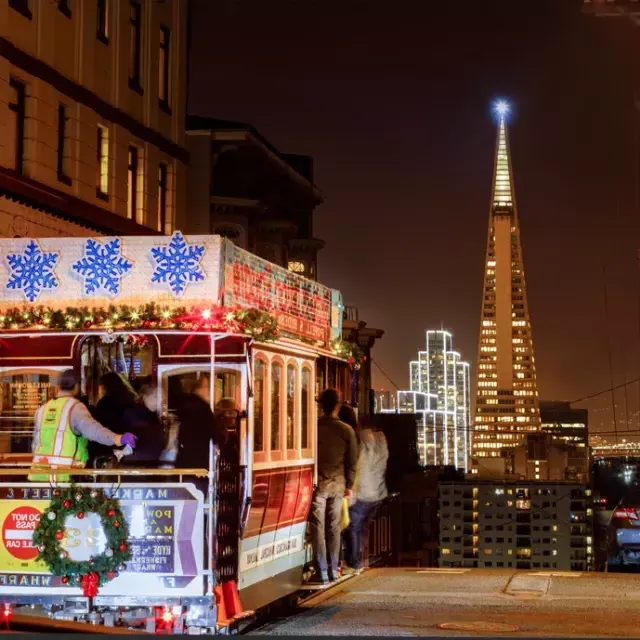 The cable cars are decorated for the holidays.